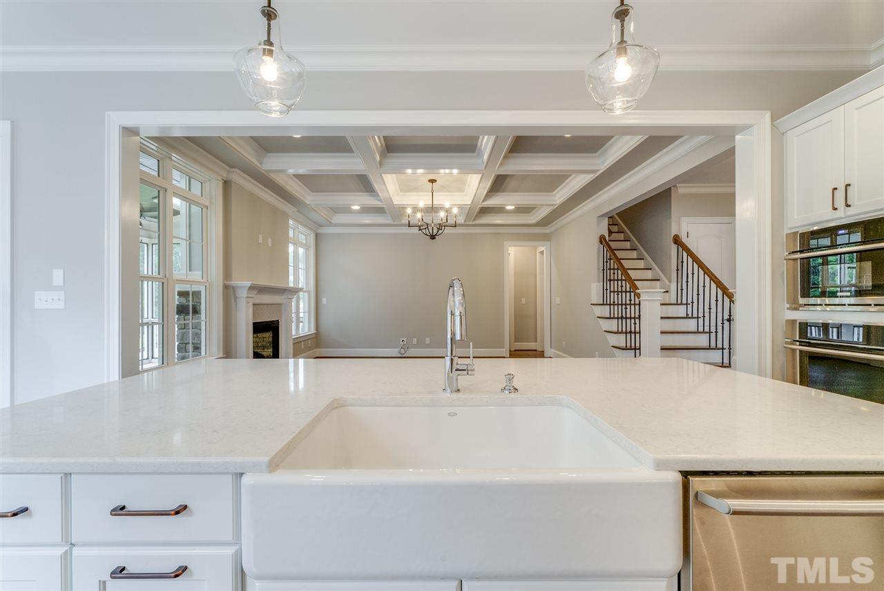 113 Roseroot Court Holly Springs, NC 27540 - Photo 7 of 25 a spacious bathroom with a sink a large mirror and vanity