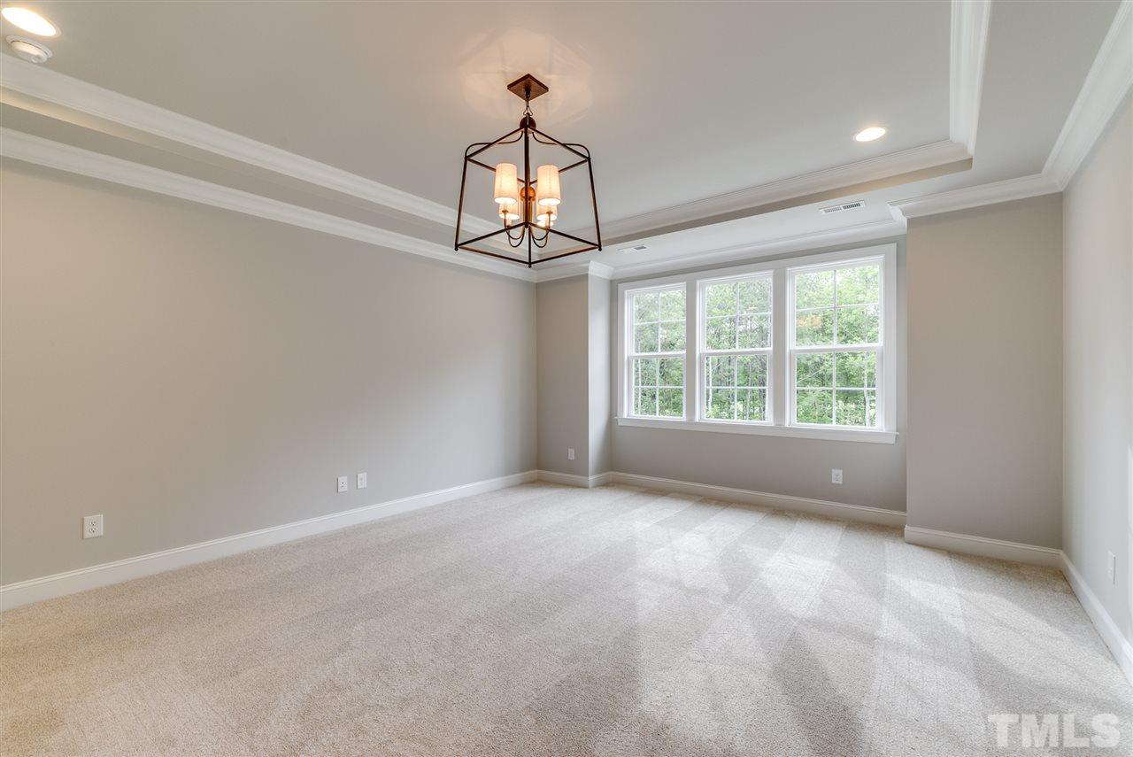 113 Roseroot Court Holly Springs, NC 27540 - Photo 9 of 25 a view of an empty room with a window