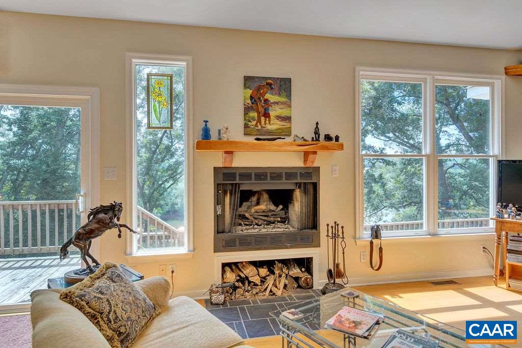 343 Wyland Road Buckingham, VA 23921 - Photo 12 of 46 a living room with furniture and a fireplace
