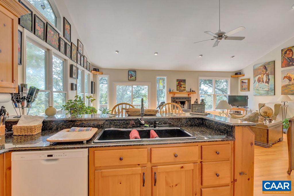 343 Wyland Road Buckingham, VA 23921 - Photo 15 of 46 a kitchen with granite countertop a sink a stove and cabinets