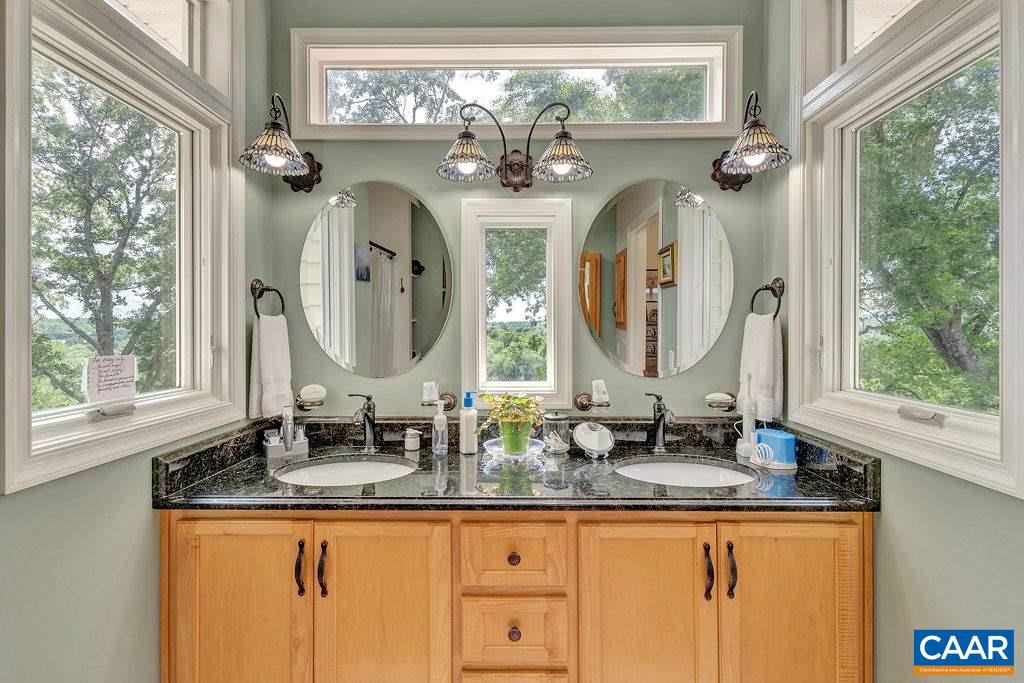 343 Wyland Road Buckingham, VA 23921 - Photo 18 of 46 a bathroom with double vanity and a mirror
