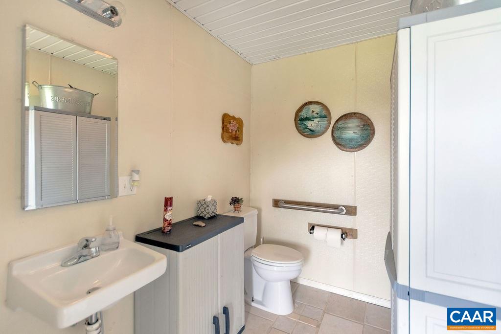 343 Wyland Road Buckingham, VA 23921 - Photo 34 of 46 a bathroom with a sink and a mirror