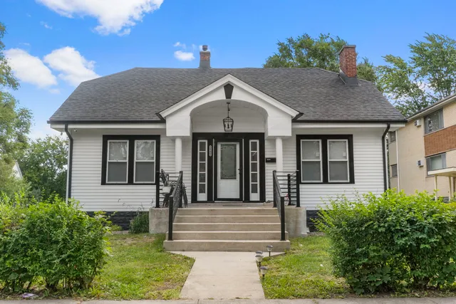 a front view of a house with yard