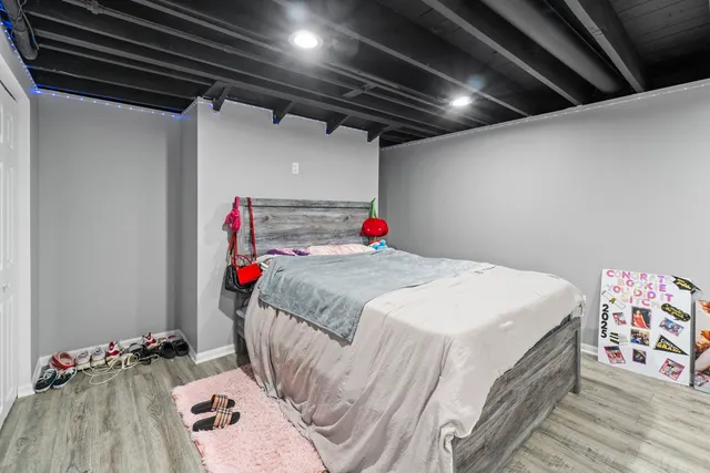 a bedroom with a bed and a table