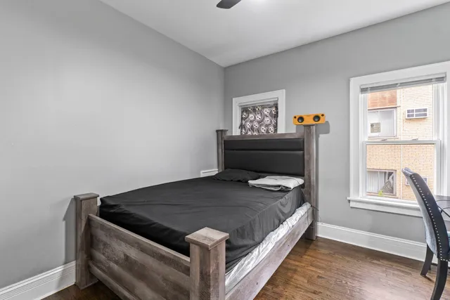 a bedroom with a bed and a window