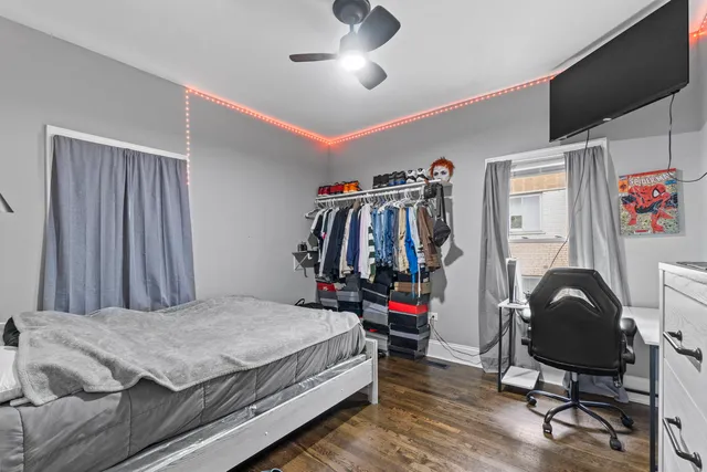 a bedroom with a bed and a desk