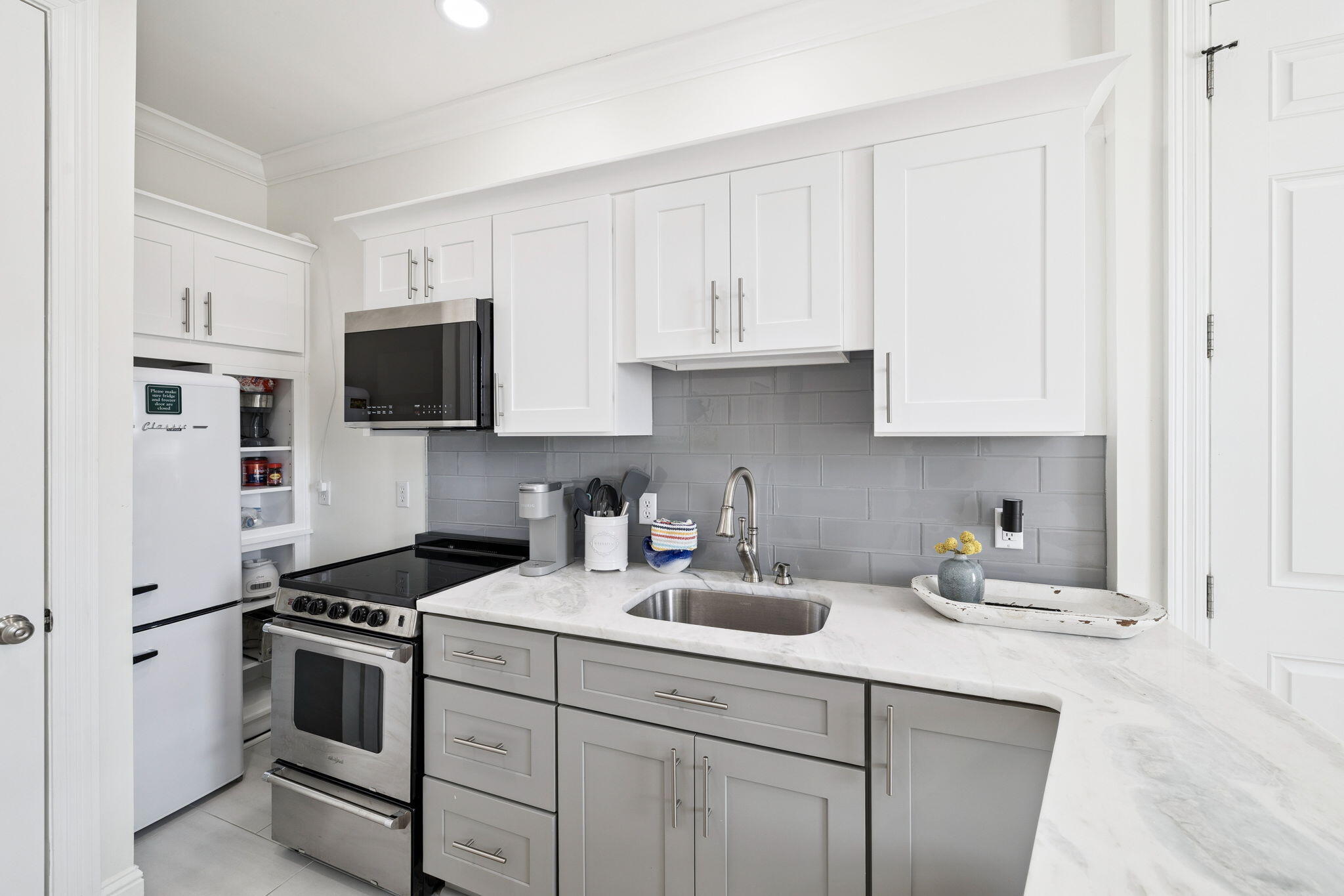 454 Beach Bike Way Inlet Beach, FL 32461 - Photo 35 of 45 a kitchen with appliances a sink and cabinets
