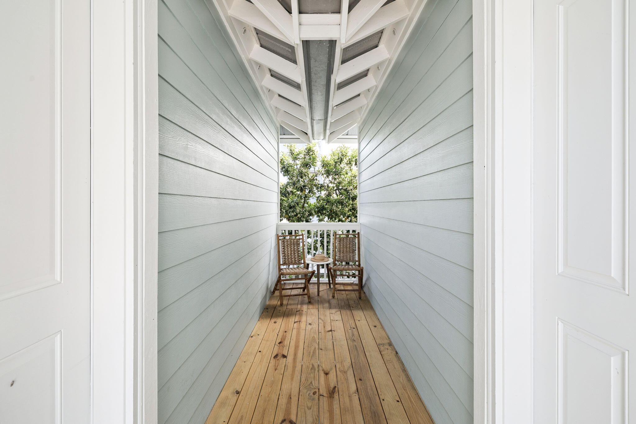 454 Beach Bike Way Inlet Beach, FL 32461 - Photo 40 of 45 a view of balcony with wooden floor and potted plant