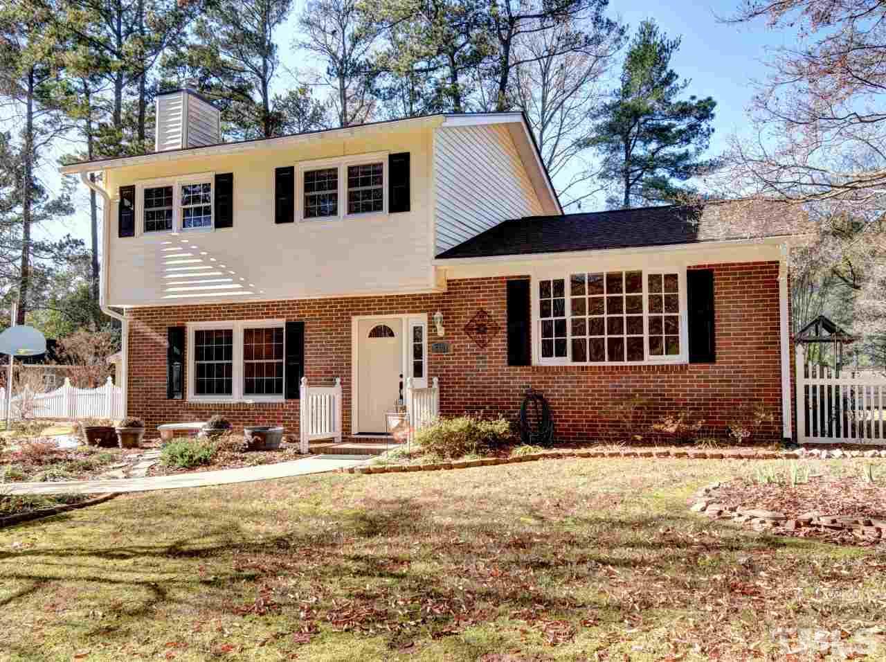 5708 Hayloft Circle Raleigh, NC 27606 - Photo 2 of 27 a front view of a house with a yard covered in snow