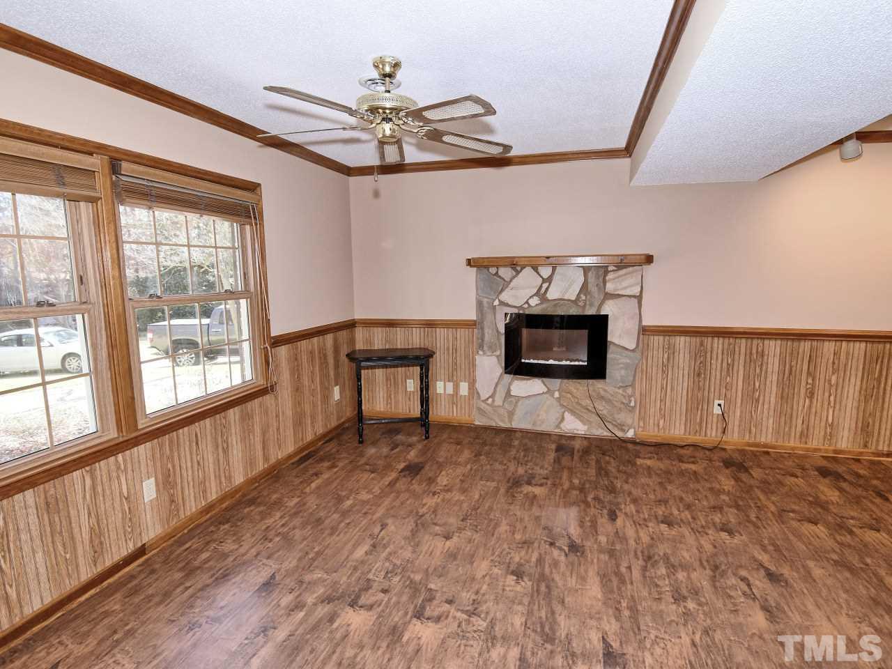 5708 Hayloft Circle Raleigh, NC 27606 - Photo 11 of 27 a living room with furniture and a fireplace