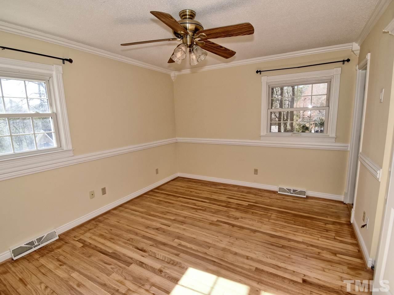 5708 Hayloft Circle Raleigh, NC 27606 - Photo 13 of 27 a view of empty room with wooden floor and fan