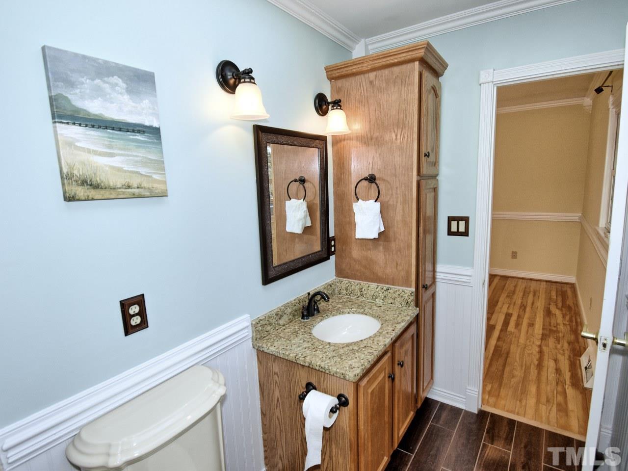 5708 Hayloft Circle Raleigh, NC 27606 - Photo 15 of 27 a bathroom with a granite countertop sink toilet and shower