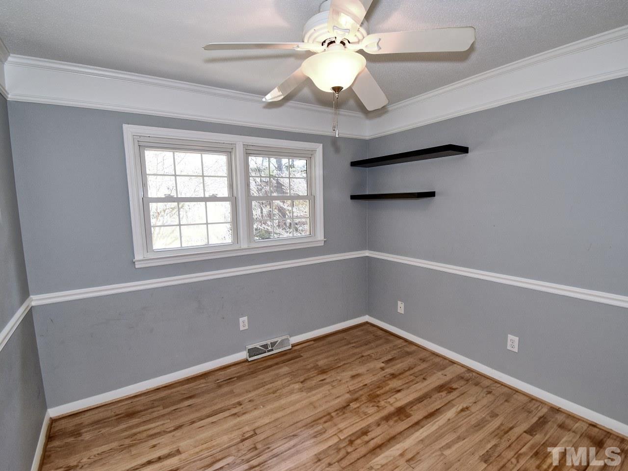 5708 Hayloft Circle Raleigh, NC 27606 - Photo 17 of 27 wooden floor in an empty room with a window