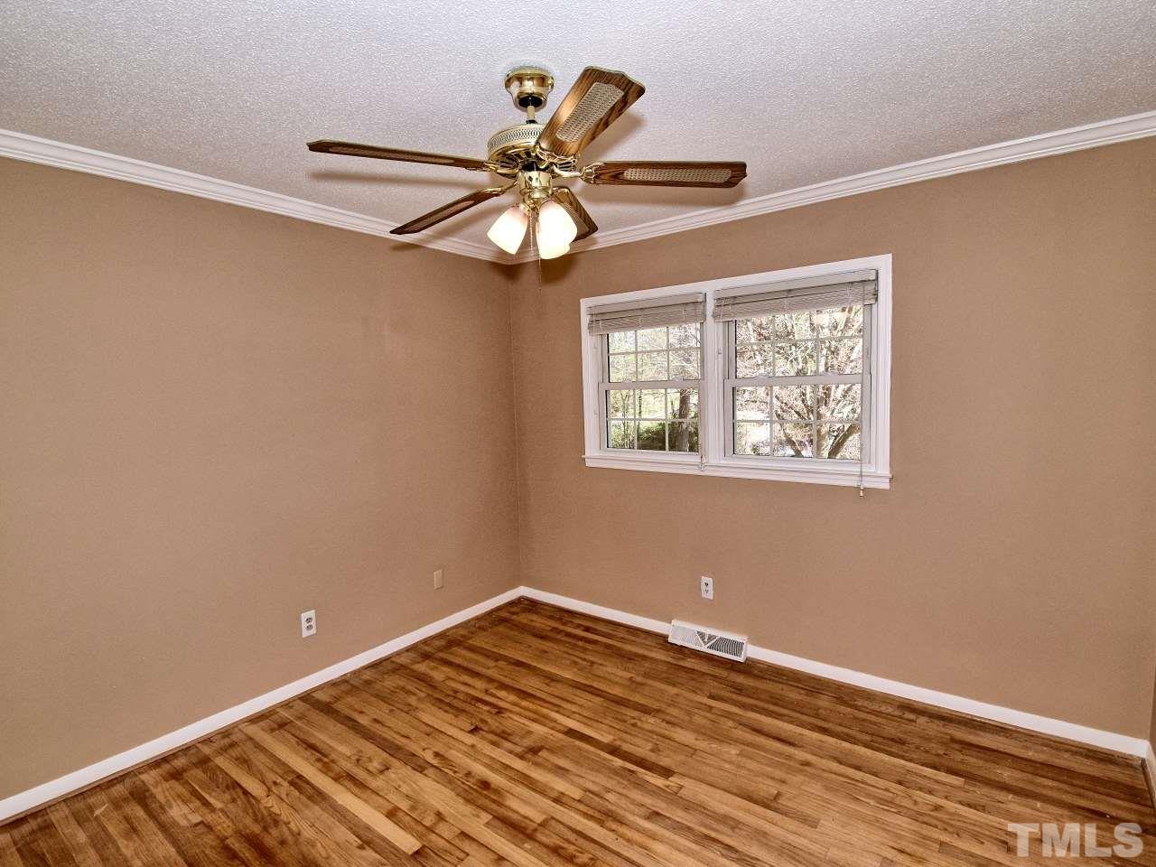 5708 Hayloft Circle Raleigh, NC 27606 - Photo 19 of 27 a view of a room with wooden floor fan and window