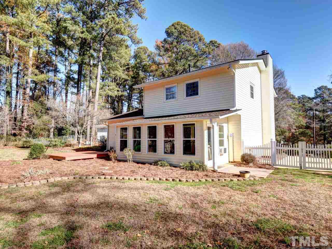 5708 Hayloft Circle Raleigh, NC 27606 - Photo 23 of 27 a front view of a house with a yard covered in snow