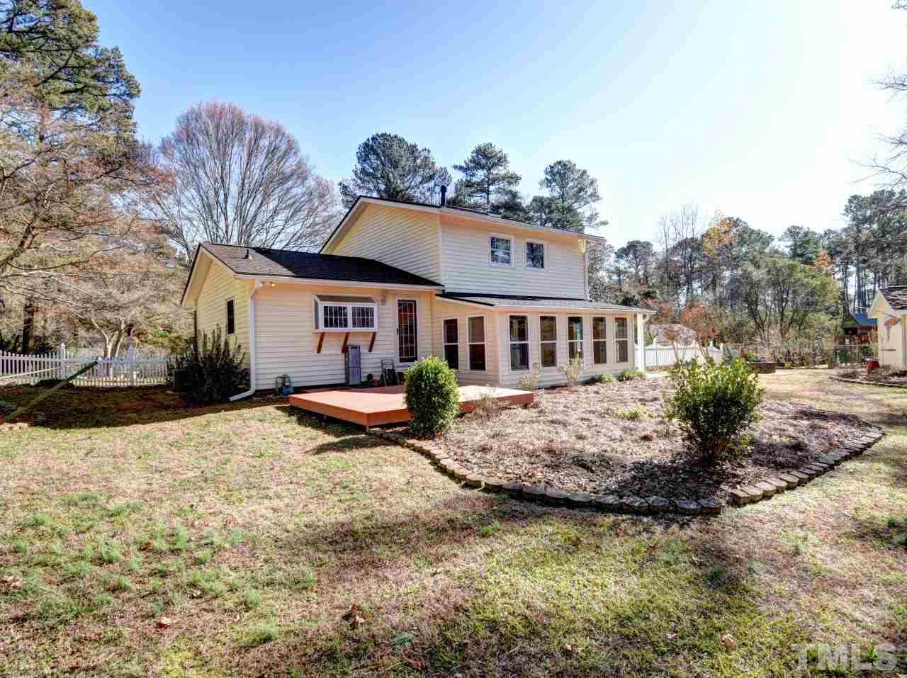 5708 Hayloft Circle Raleigh, NC 27606 - Photo 24 of 27 a front view of a house with a yard covered in snow