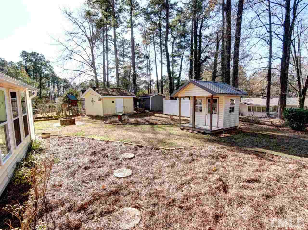 5708 Hayloft Circle Raleigh, NC 27606 - Photo 27 of 27 a house with trees in front of it