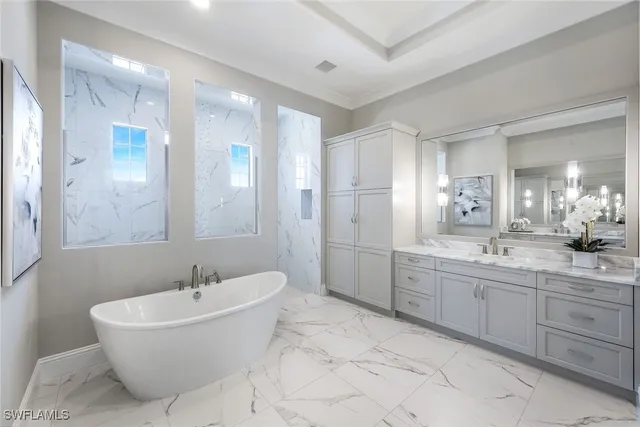 a bathroom with a bathtub shower sink and mirror