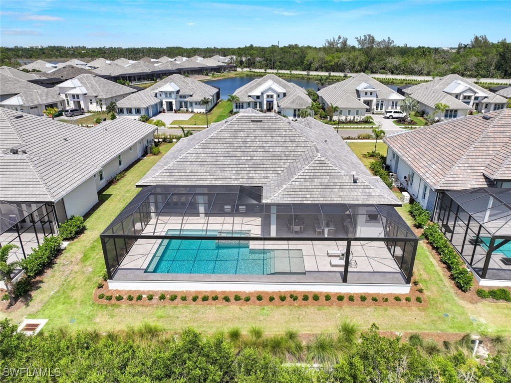 8903 Nevis Way Naples, FL 34112 - Photo 25 of 36 an aerial view of residential houses with outdoor space and swimming pool