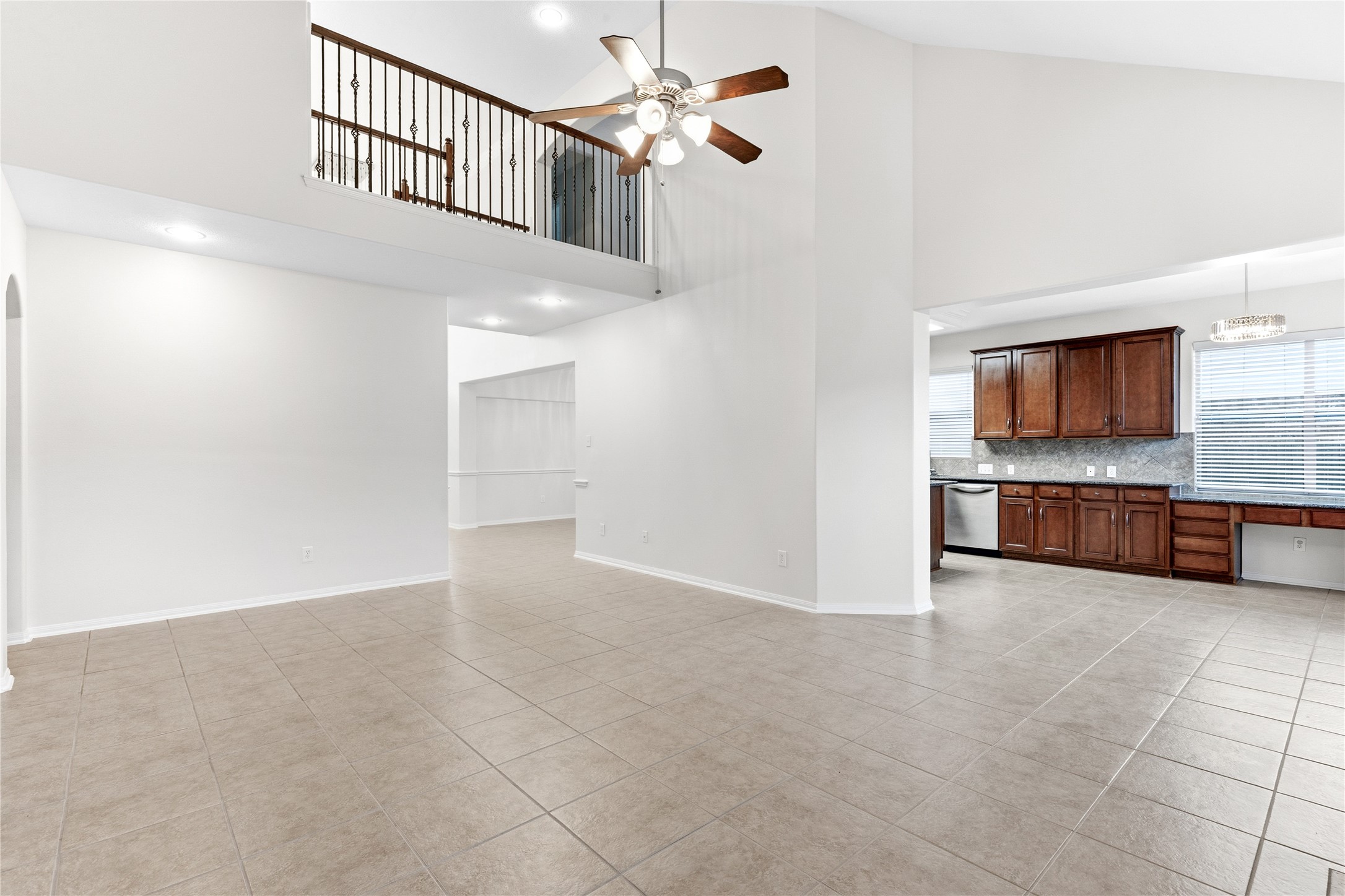 6211 Stone Hill Road Spring, TX 77389 - Photo 10 of 43 a view of a kitchen with a sink and a ceiling fan