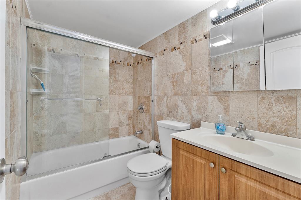 518 Durham, Unit 518 Deerfield Beach, FL 33442 - Photo 11 of 31 a bathroom with a sink toilet and shower
