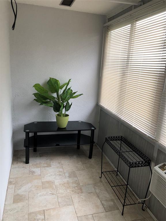 518 Durham, Unit 518 Deerfield Beach, FL 33442 - Photo 12 of 31 a flower sitting in a room next to a window