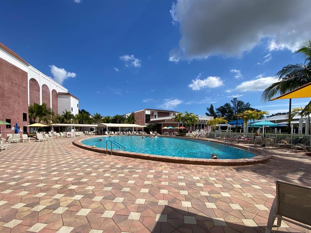518 Durham, Unit 518 Deerfield Beach, FL 33442 - Photo 22 of 31 a view of a swimming pool with a patio