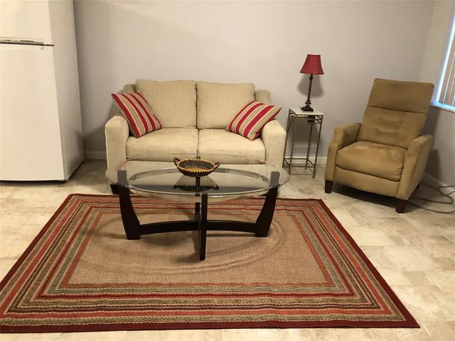 a living room with furniture and a couch