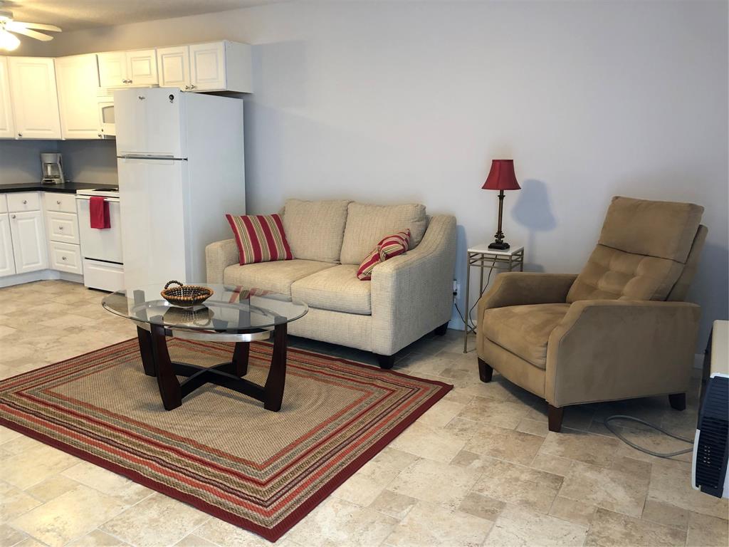 518 Durham, Unit 518 Deerfield Beach, FL 33442 - Photo 8 of 31 a living room with furniture and a couch