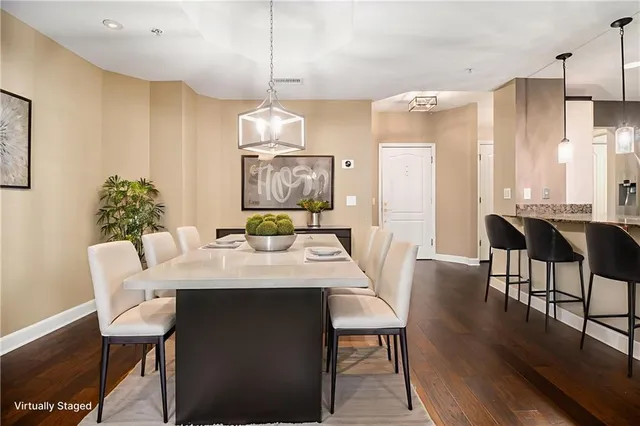 a view of a dining room with furniture window and wooden floor