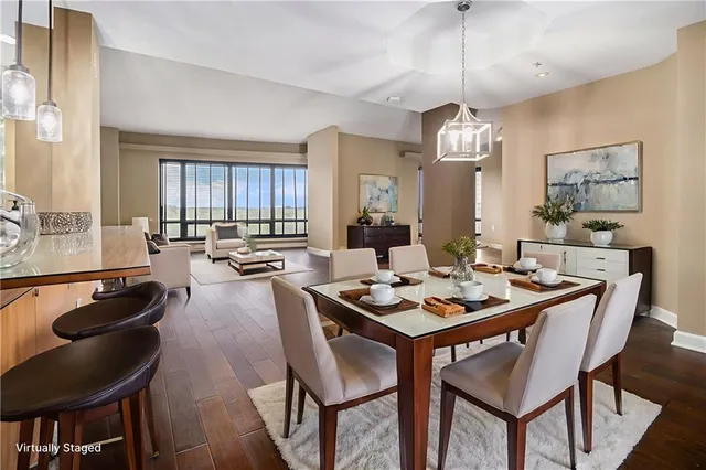 a large kitchen with a table and chairs
