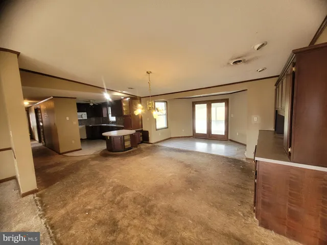 a view of livingroom with furniture and a window