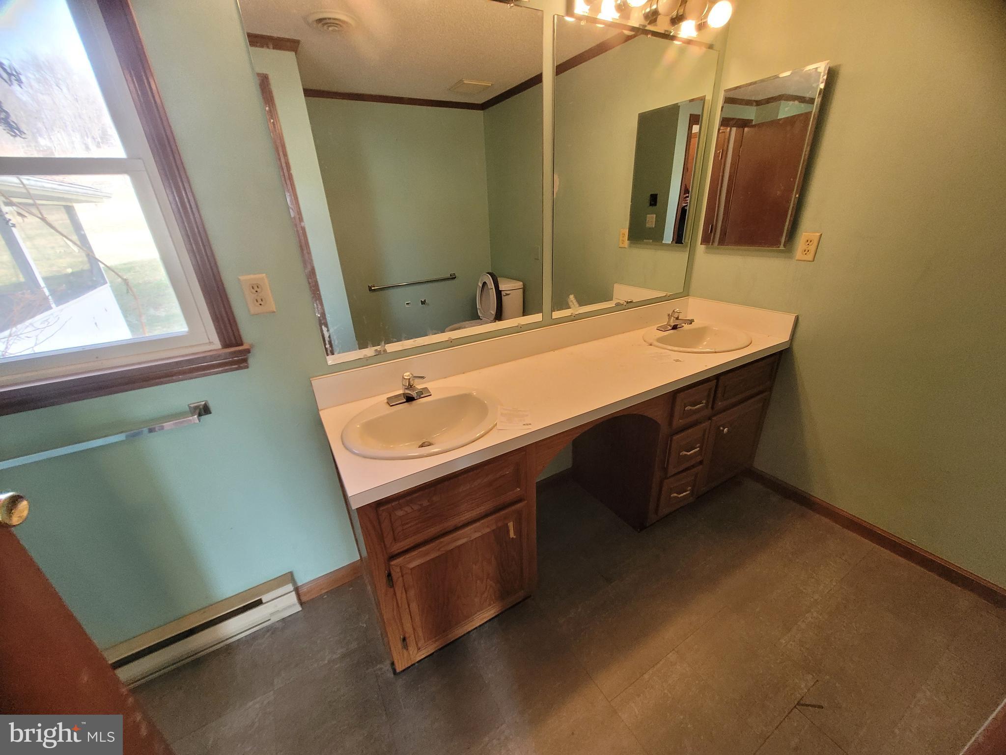 16821 Porter Road Northwest Frostburg, MD 21532 - Photo 31 of 39 a bathroom with a sink and a mirror