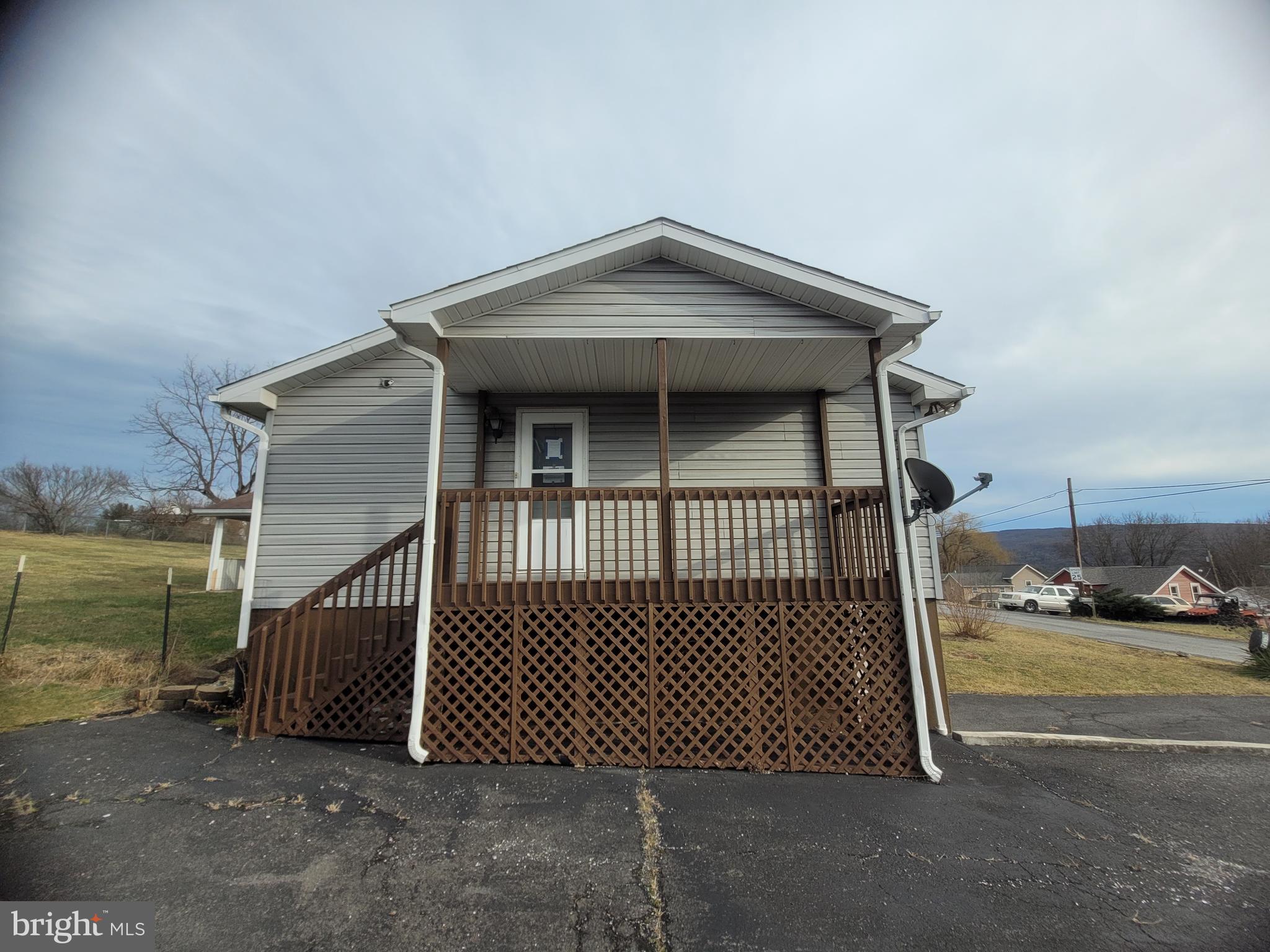 16821 Porter Road Northwest Frostburg, MD 21532 - Photo 6 of 39 a view of a brick house with a small yard