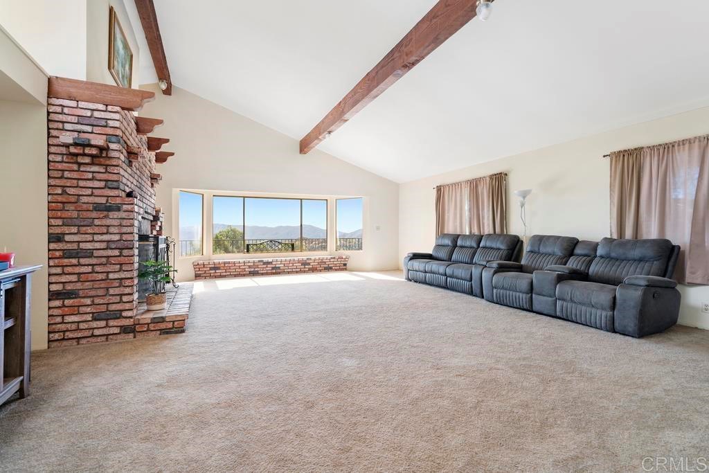 865 Mountain View Road El Cajon, CA 92021 - Photo 1 of 1 a living room with furniture and a flat screen tv