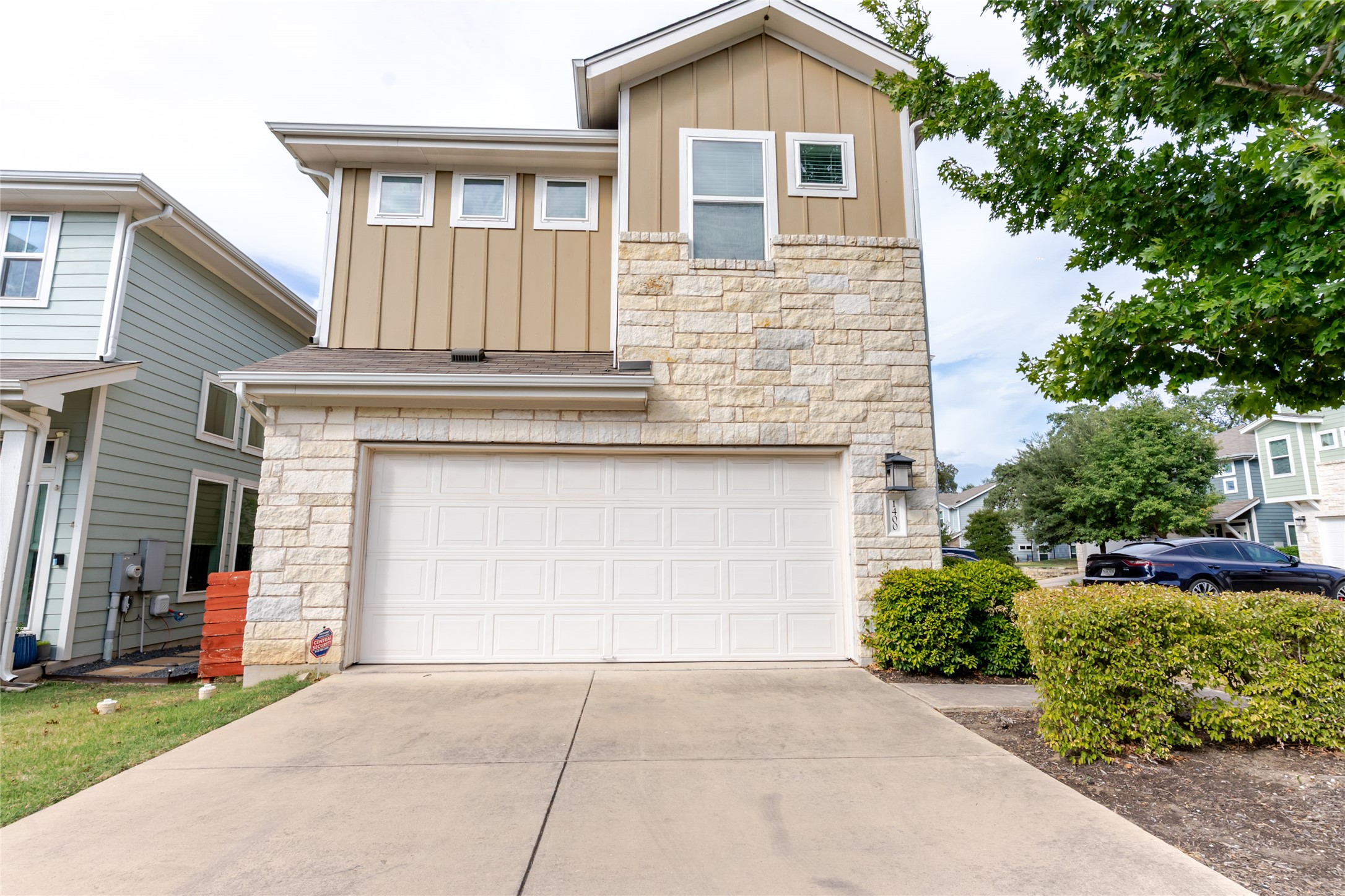 1400 Homespun Road Austin, TX 78745 - Photo 4 of 30 Attractive stone accents and vertical siding create striking curb appeal on this contemporary home.
