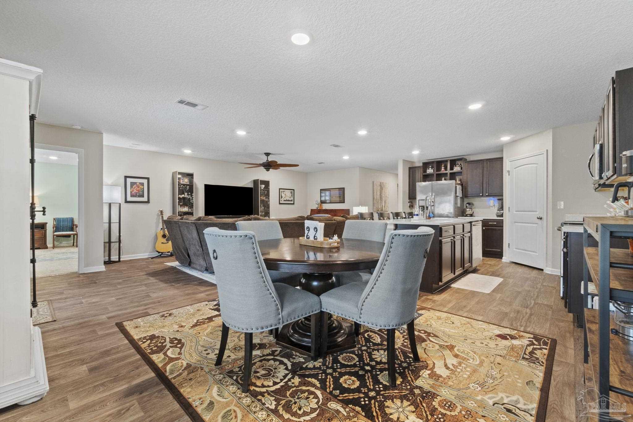 4082 Chickadee Street Milton, FL 32583 - Photo 15 of 43 a view of a dining room with furniture