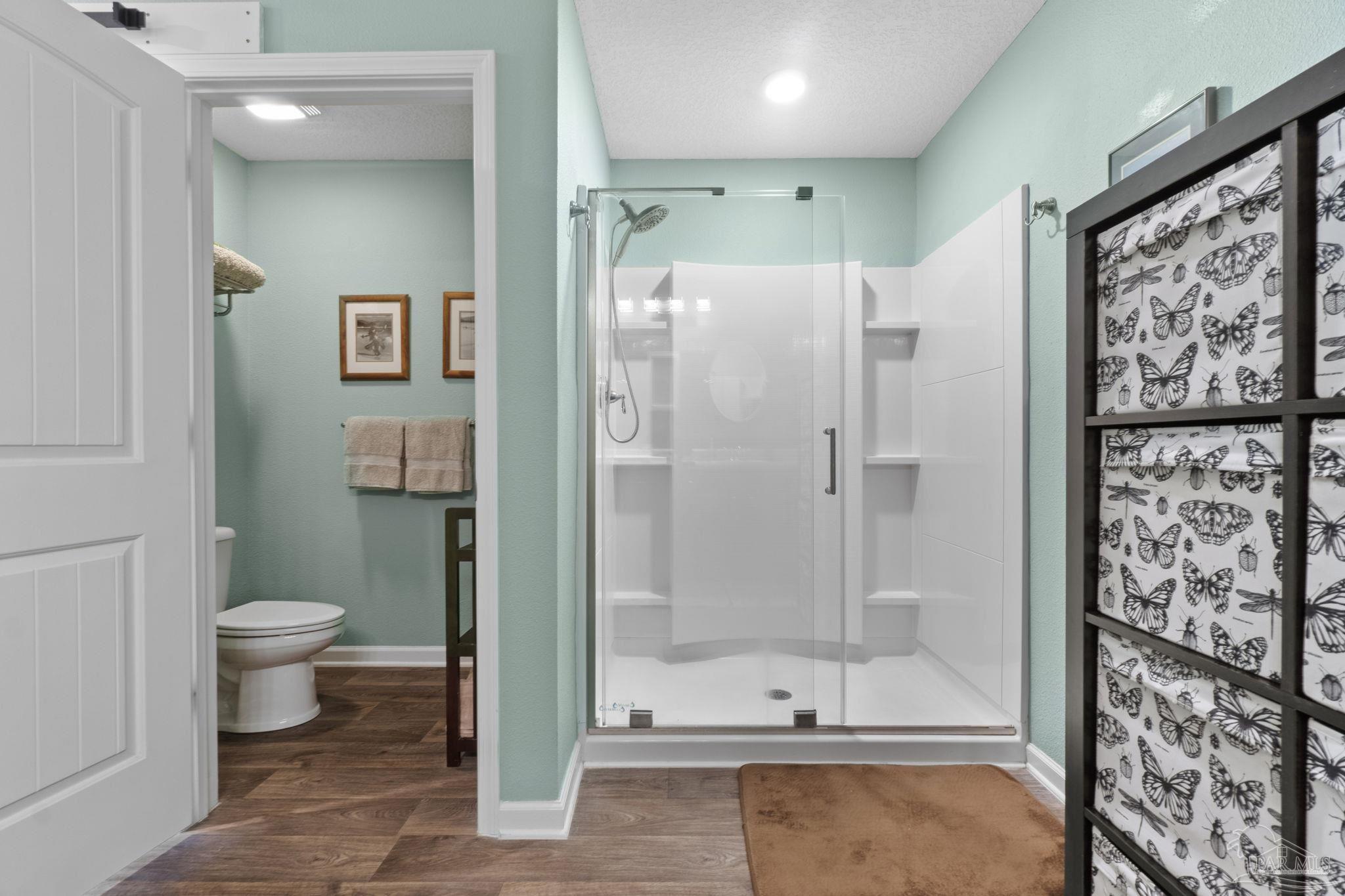 4082 Chickadee Street Milton, FL 32583 - Photo 27 of 43 a bathroom with a shower and a toilet