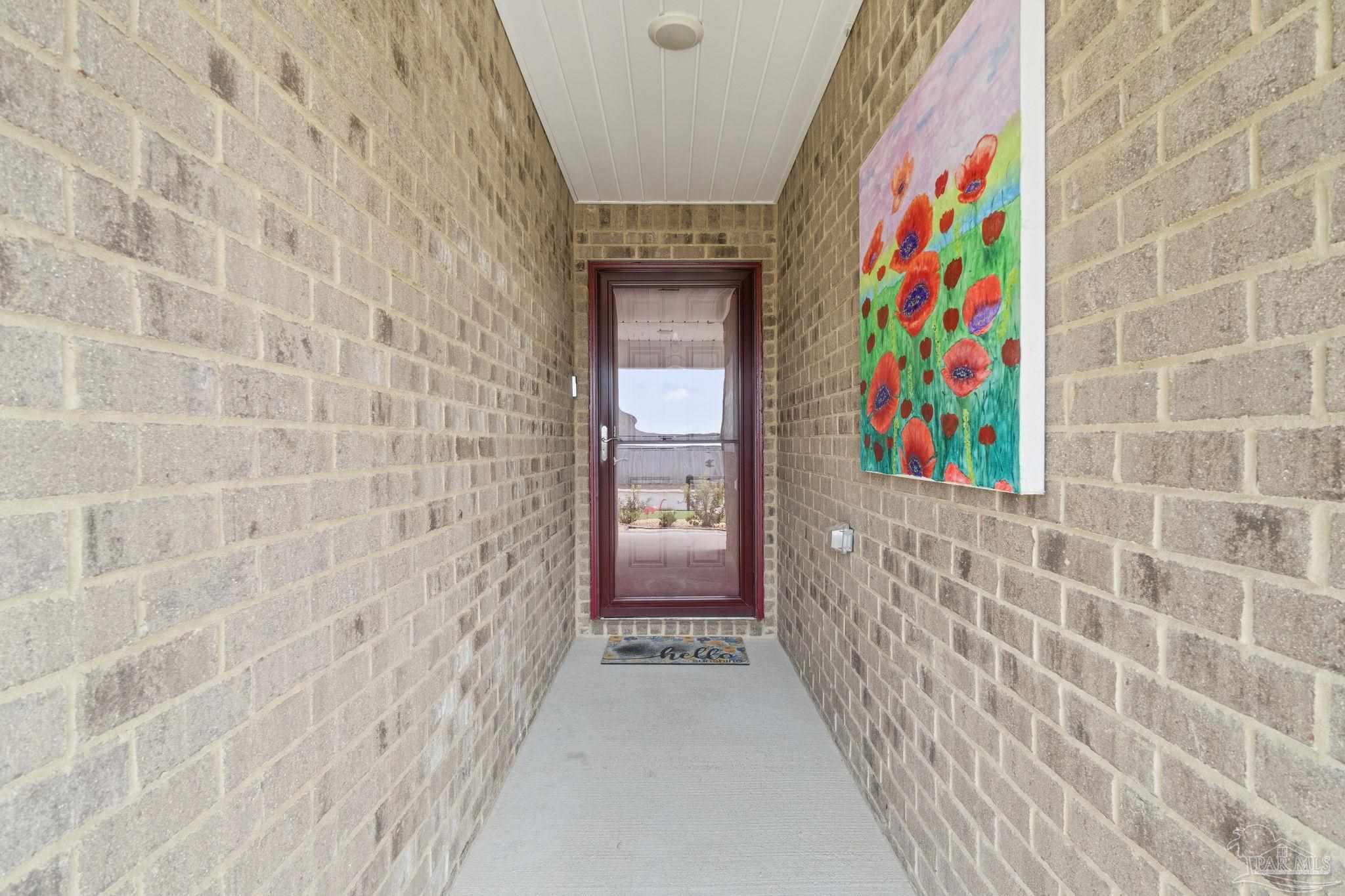 4082 Chickadee Street Milton, FL 32583 - Photo 7 of 43 a entryway with painting on the wall