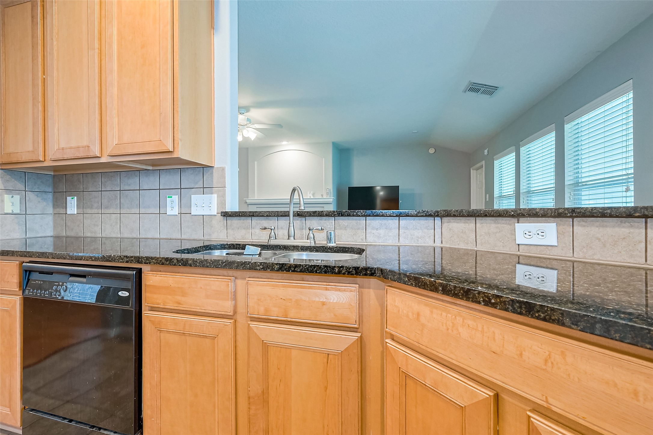 1007 Casting Springs Way Spring, TX 77373 - Photo 21 of 43 a kitchen with granite countertop white cabinets and a sink