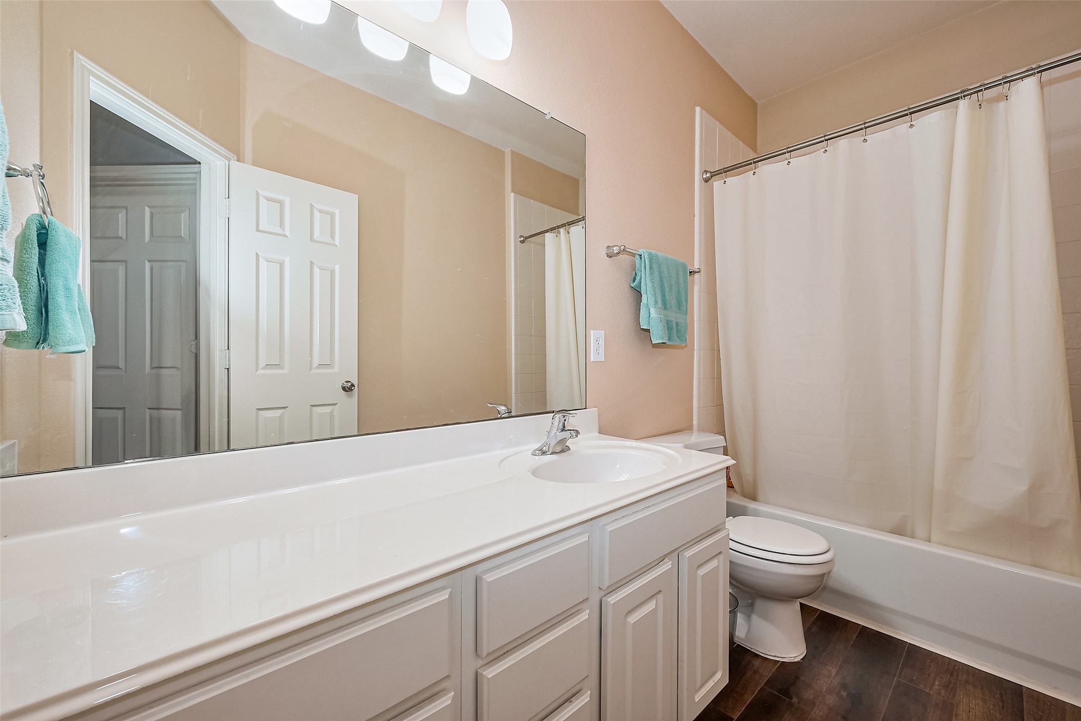 1007 Casting Springs Way Spring, TX 77373 - Photo 24 of 43 a bathroom with a sink a toilet and shower