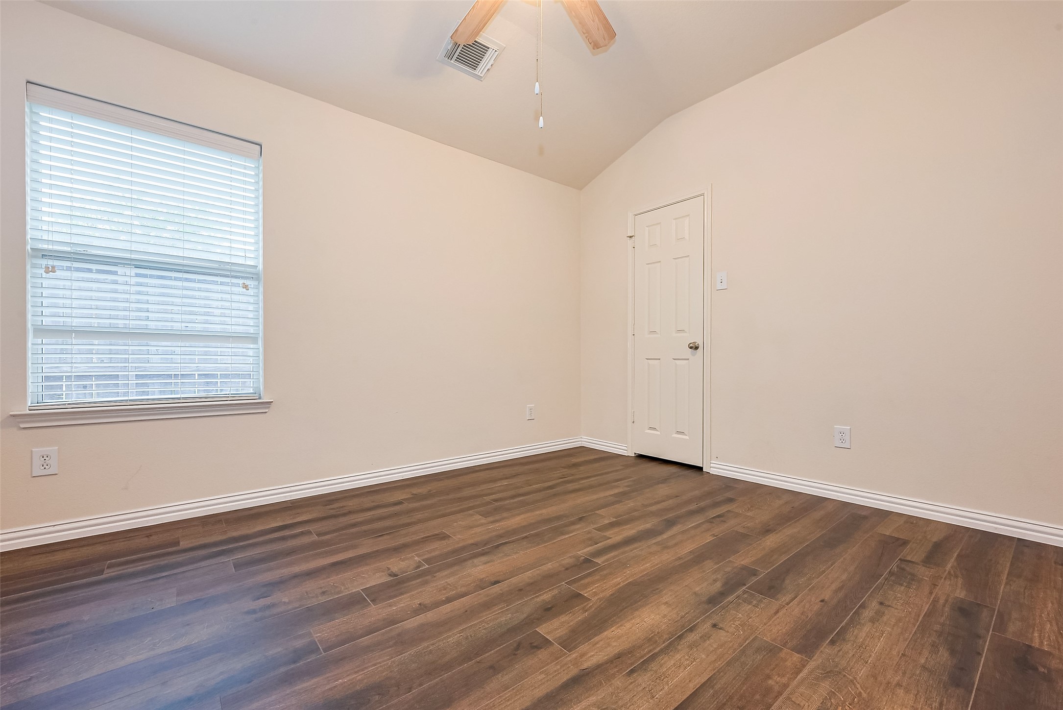1007 Casting Springs Way Spring, TX 77373 - Photo 28 of 43 wooden floor in an empty room with a window