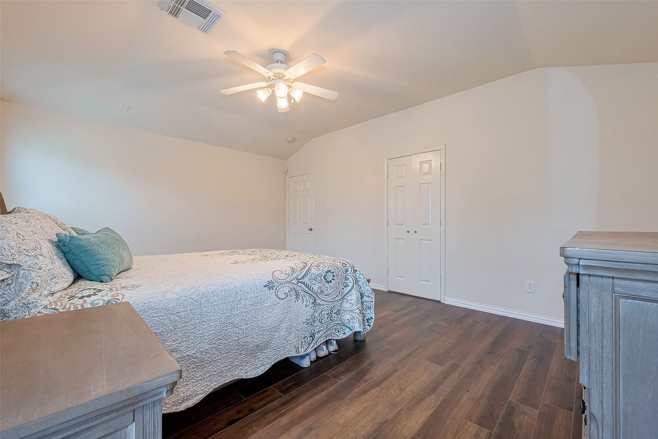 1007 Casting Springs Way Spring, TX 77373 - Photo 30 of 43 a bedroom with a bed and a chandelier