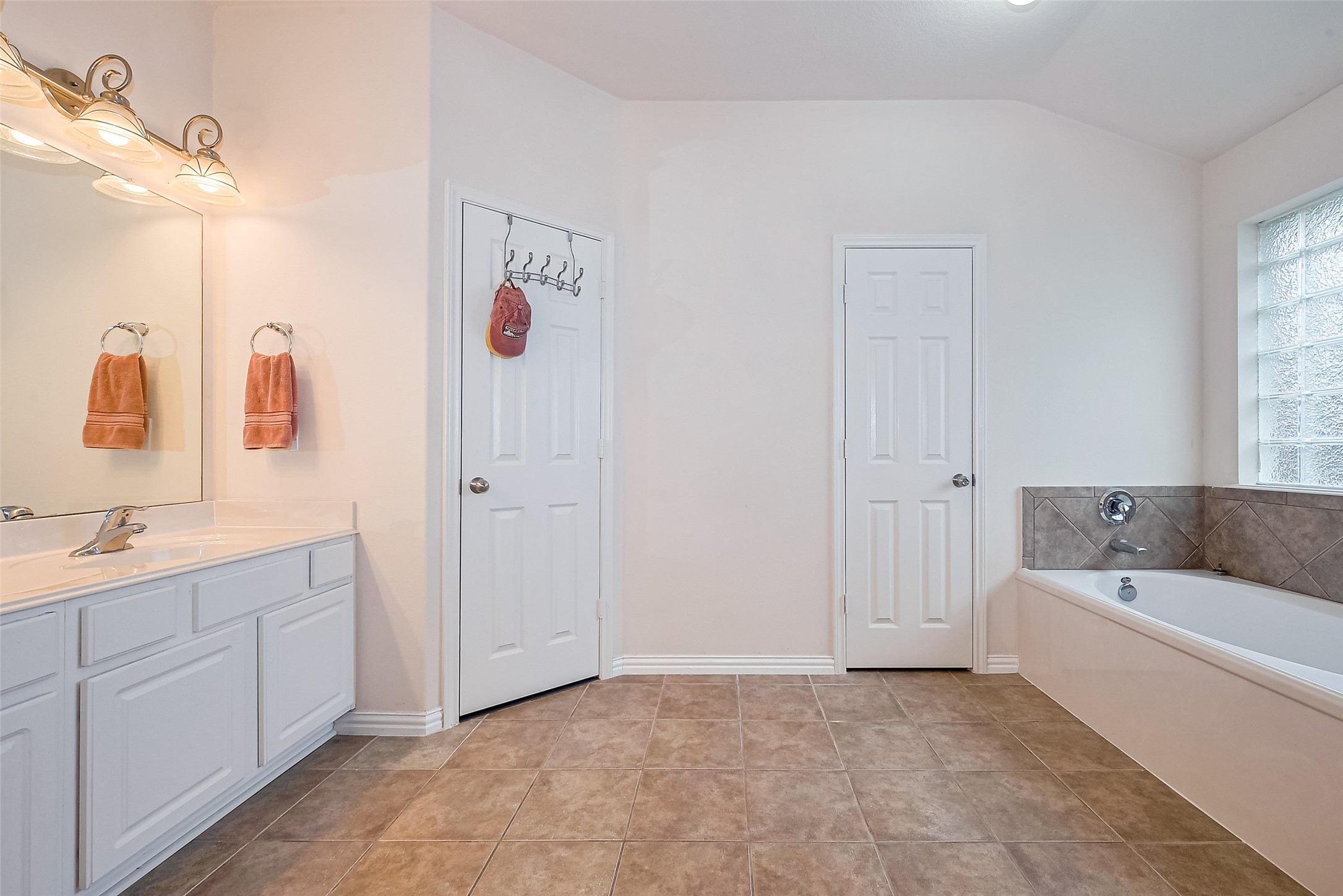 1007 Casting Springs Way Spring, TX 77373 - Photo 32 of 43 a bathroom with a tub a sink and mirror