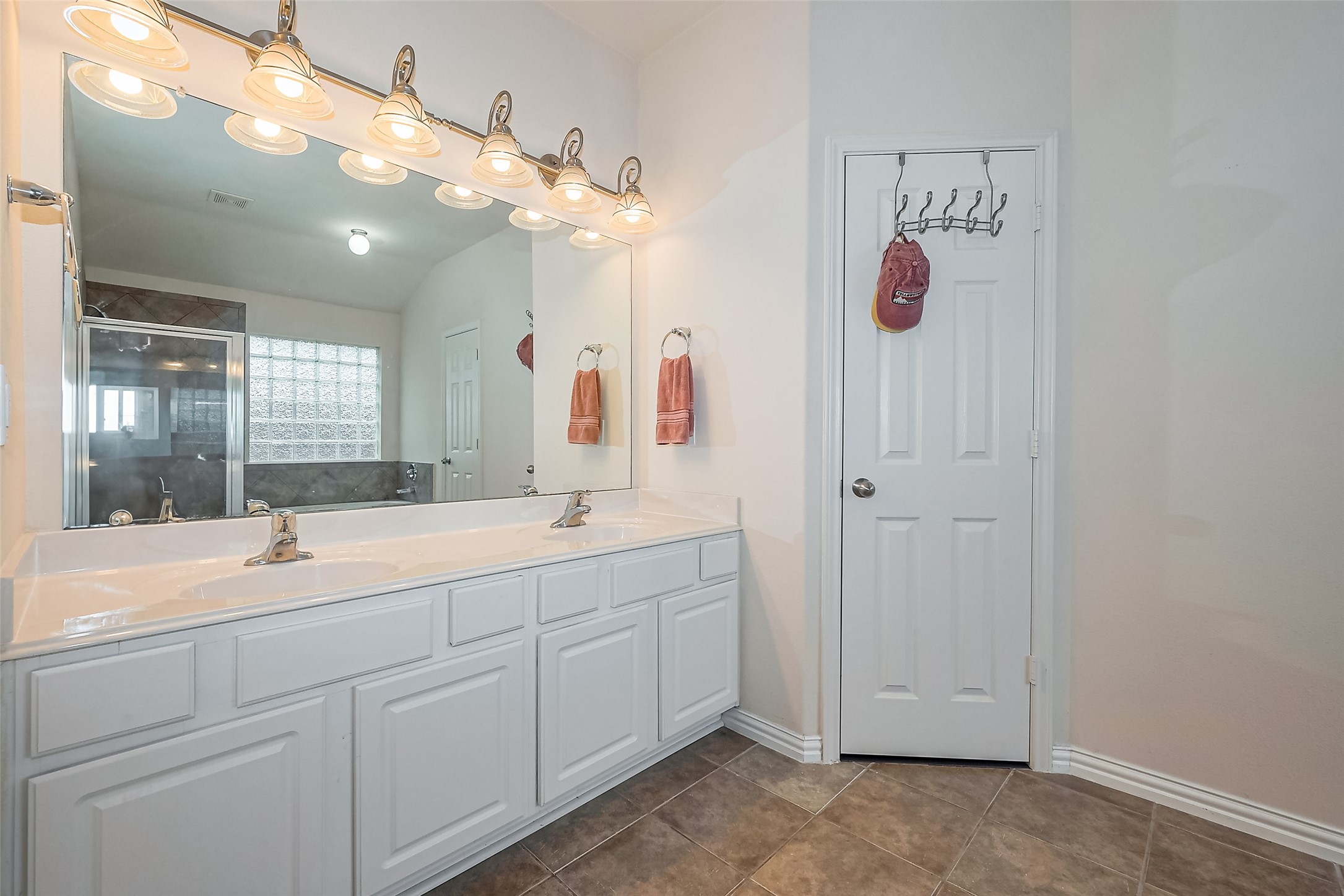1007 Casting Springs Way Spring, TX 77373 - Photo 33 of 43 a bathroom with a sink vanity and mirror