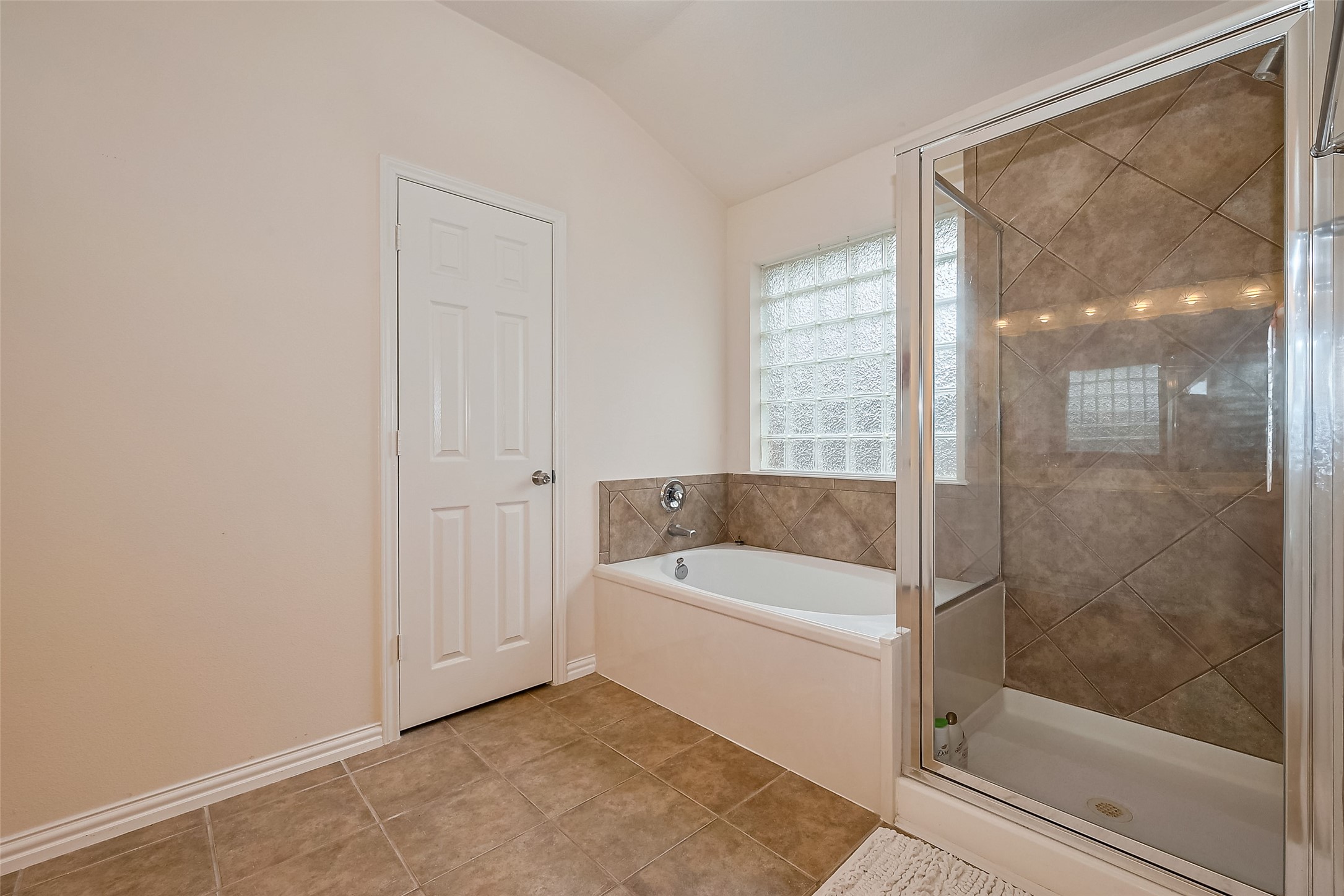 1007 Casting Springs Way Spring, TX 77373 - Photo 34 of 43 a bathroom with a bathtub and a shower