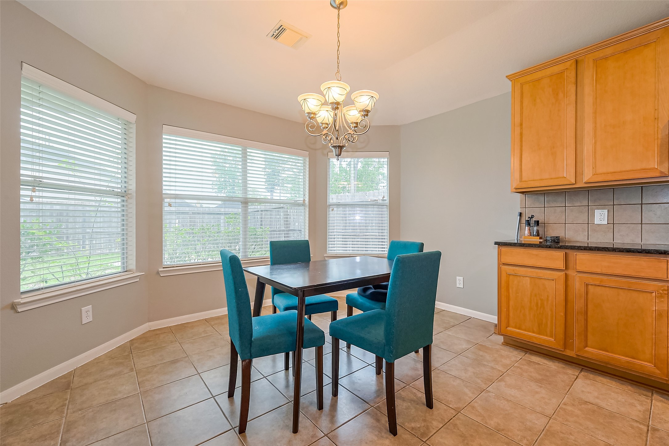 1007 Casting Springs Way Spring, TX 77373 - Photo 6 of 43 a view of a dining room with furniture window and outside view