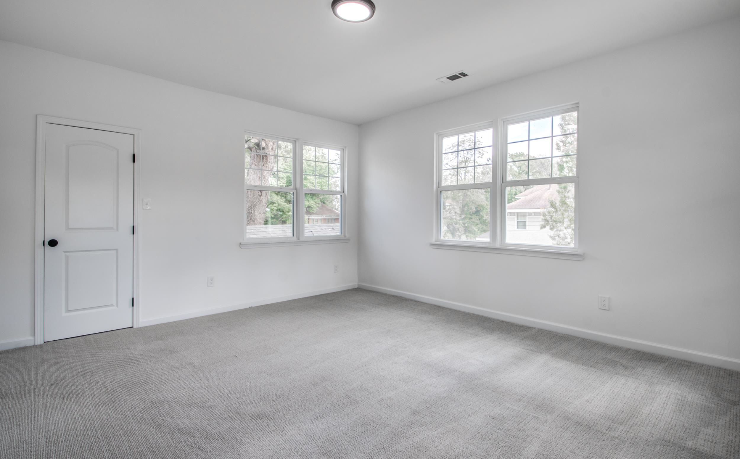 1781 Forest Avenue Memphis, TN 38112 - Photo 12 of 30 Empty room featuring carpet flooring and baseboards