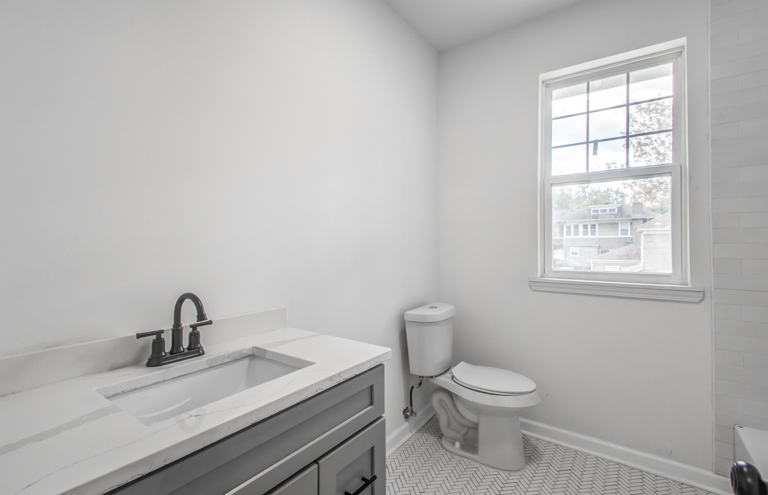 1781 Forest Avenue Memphis, TN 38112 - Photo 13 of 30 Bathroom featuring vanity and light tile patterned flooring