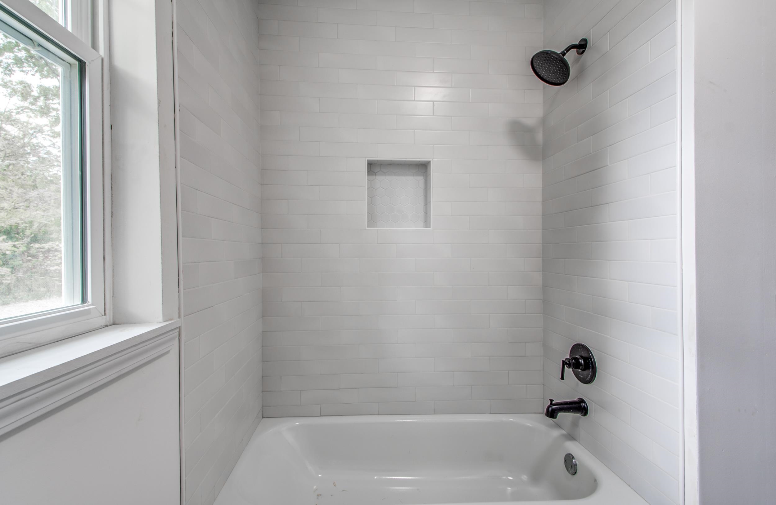1781 Forest Avenue Memphis, TN 38112 - Photo 14 of 30 Full bathroom with healthy amount of natural light and shower / bath combination